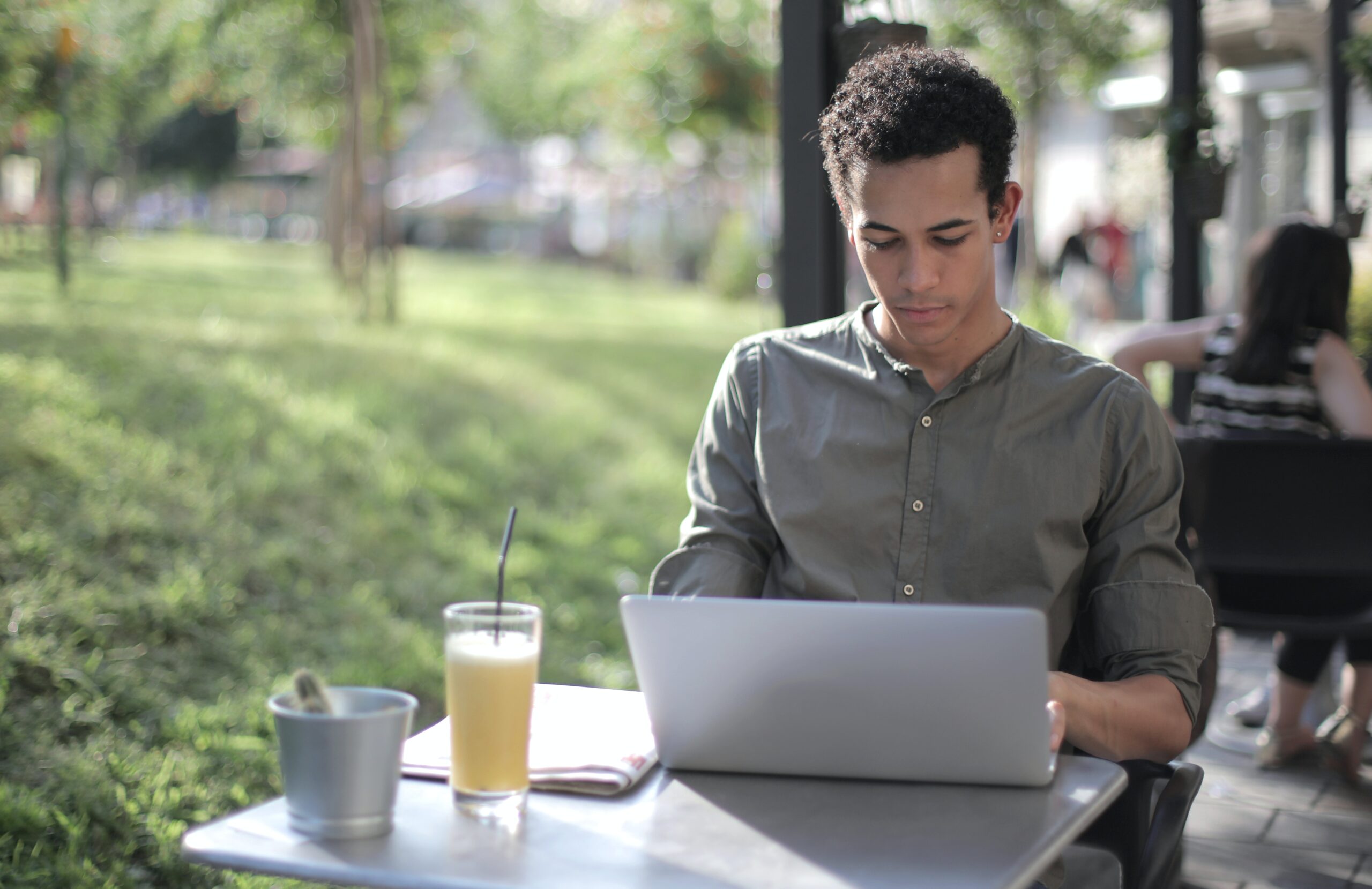 man sitting outside working