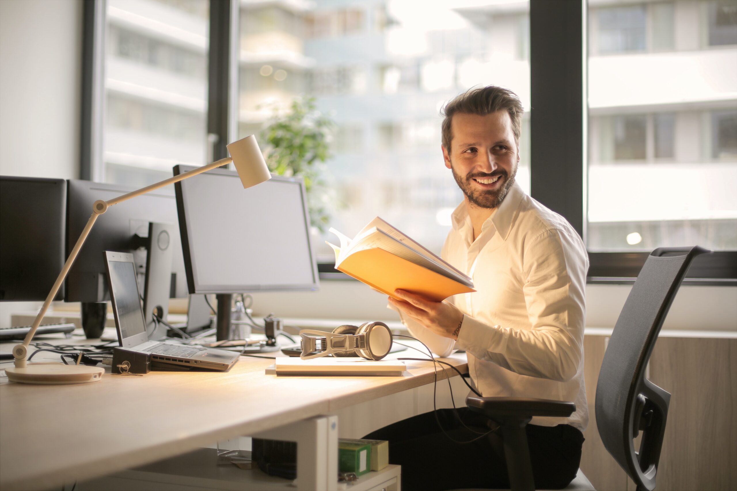 man smiling reading