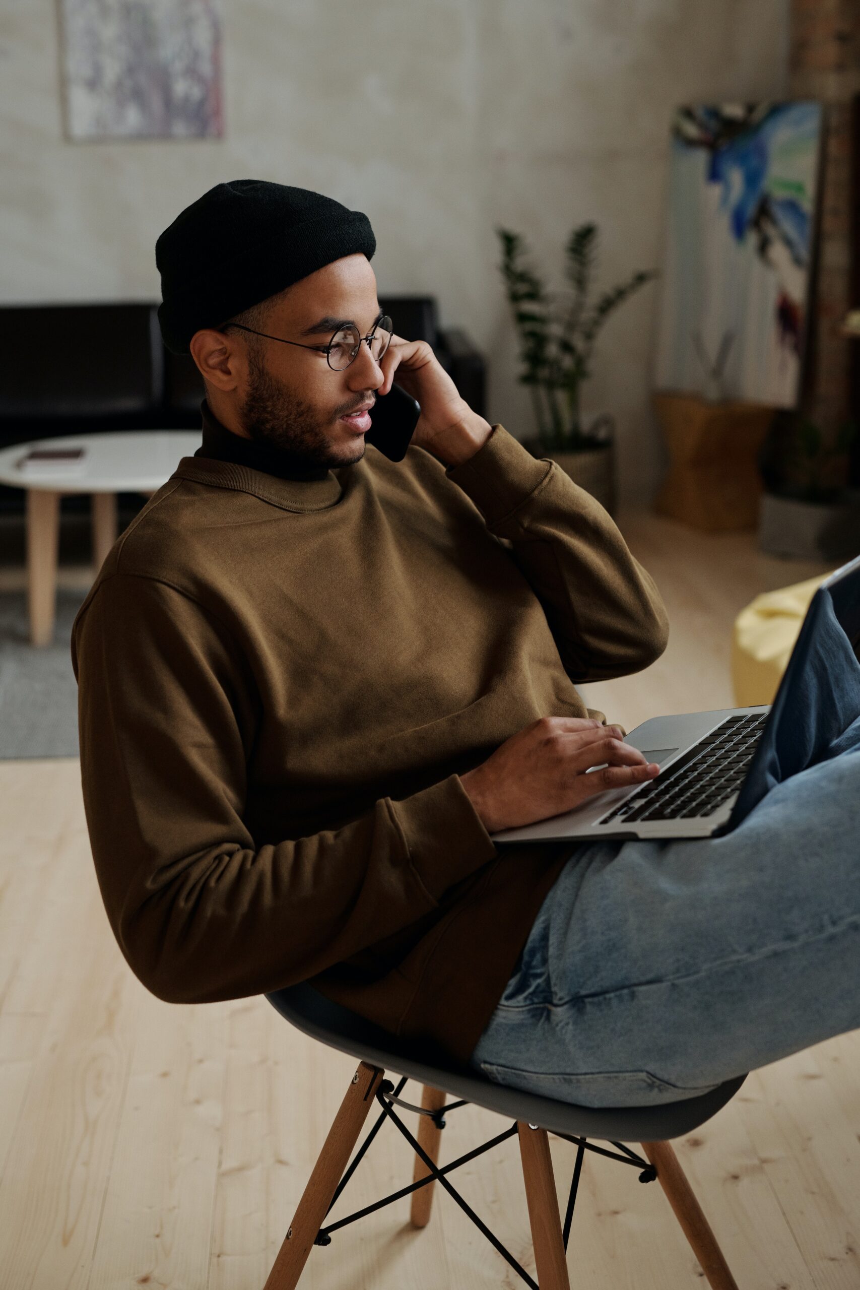 Man sitting on chair on cell phone