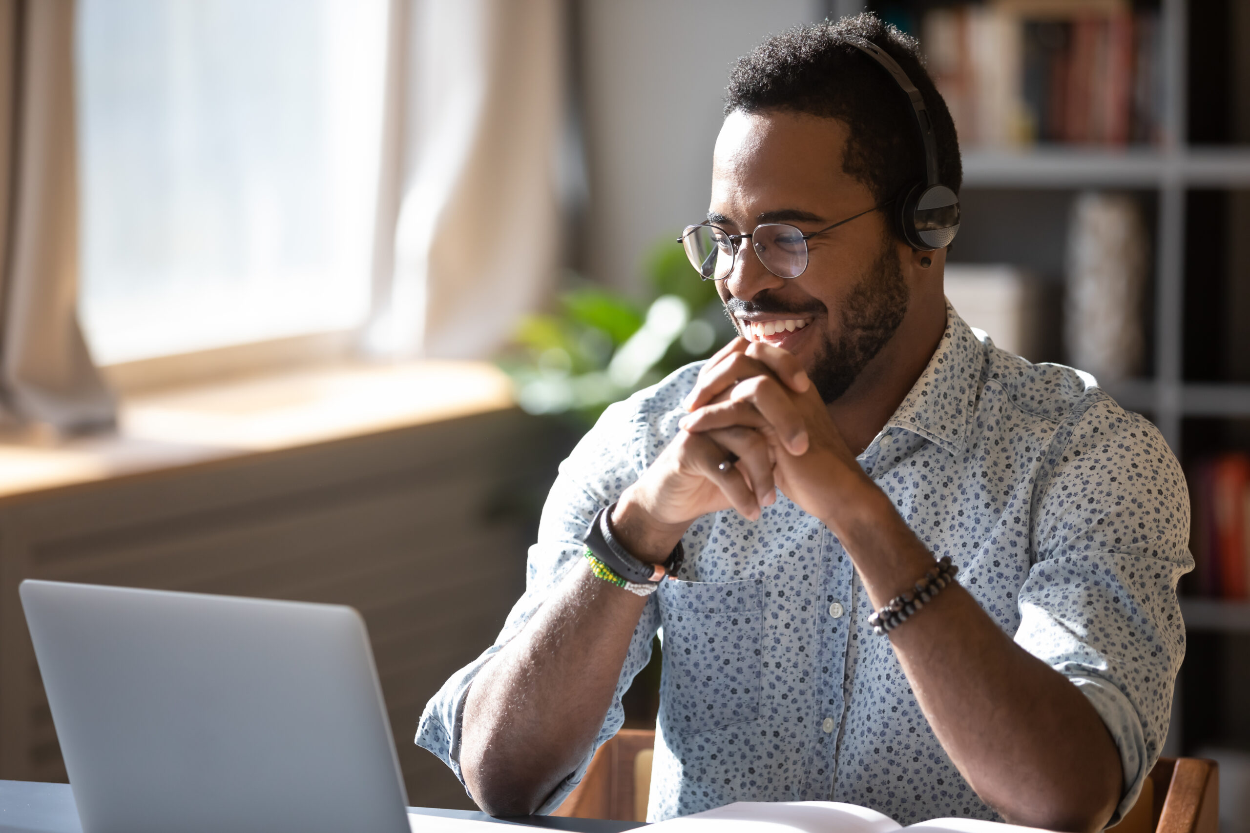 Man smiling looking at computer