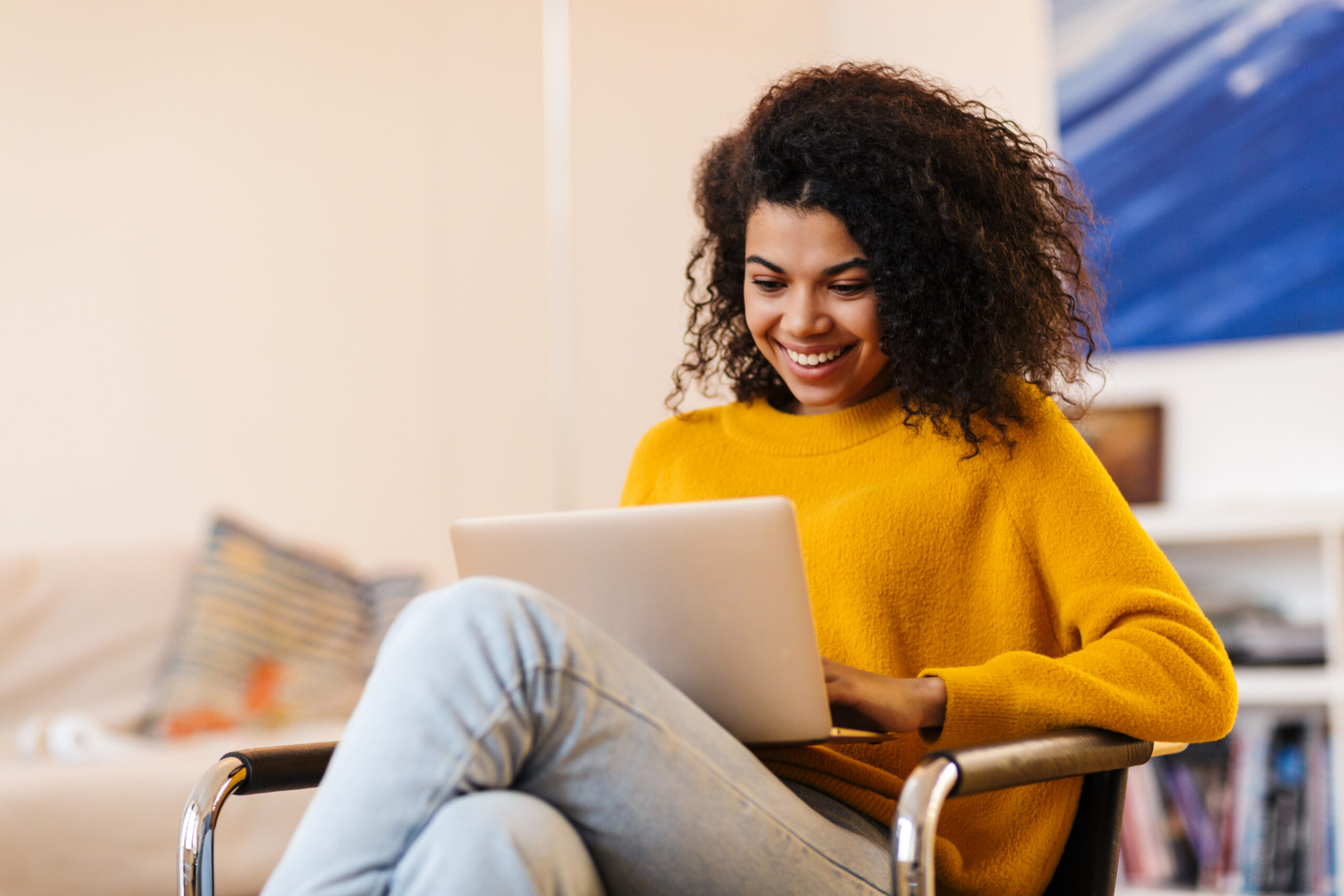 Women smiling with computer on lap