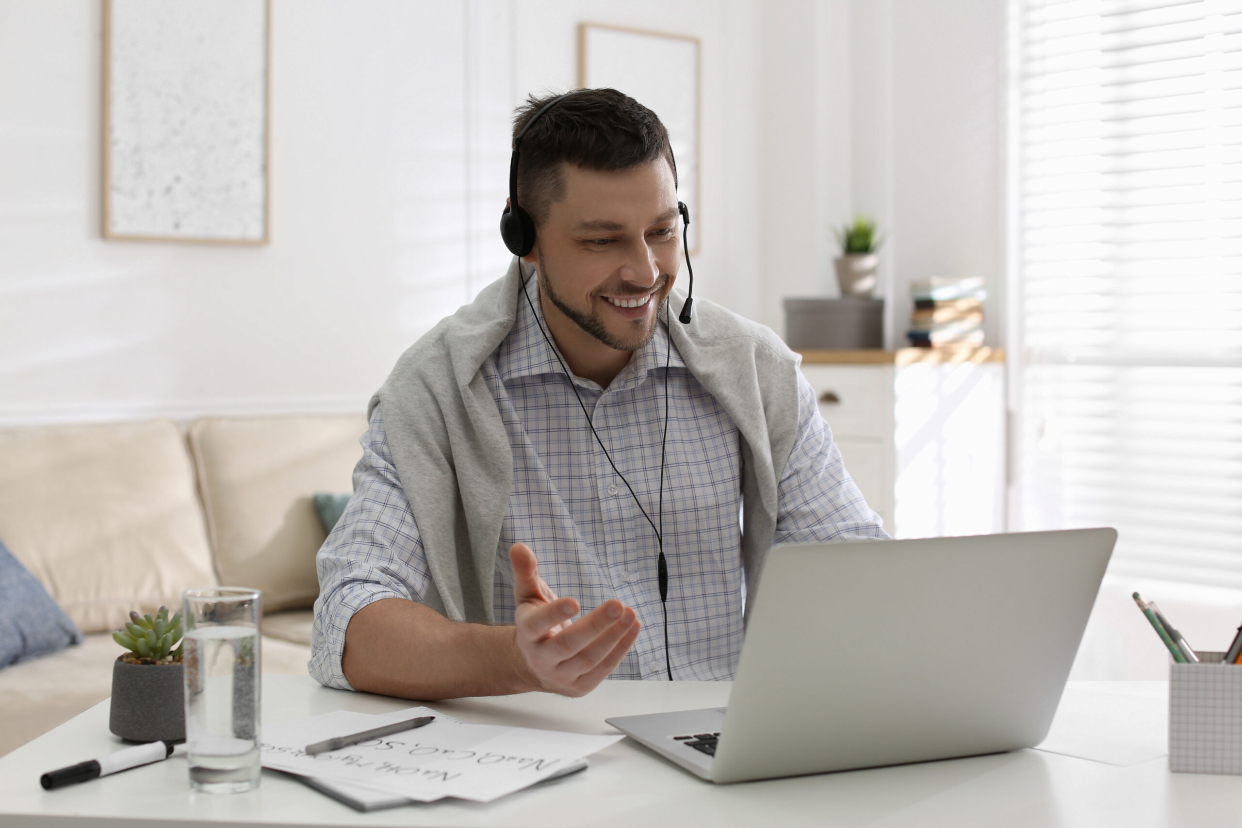 Happy man sitting at computer