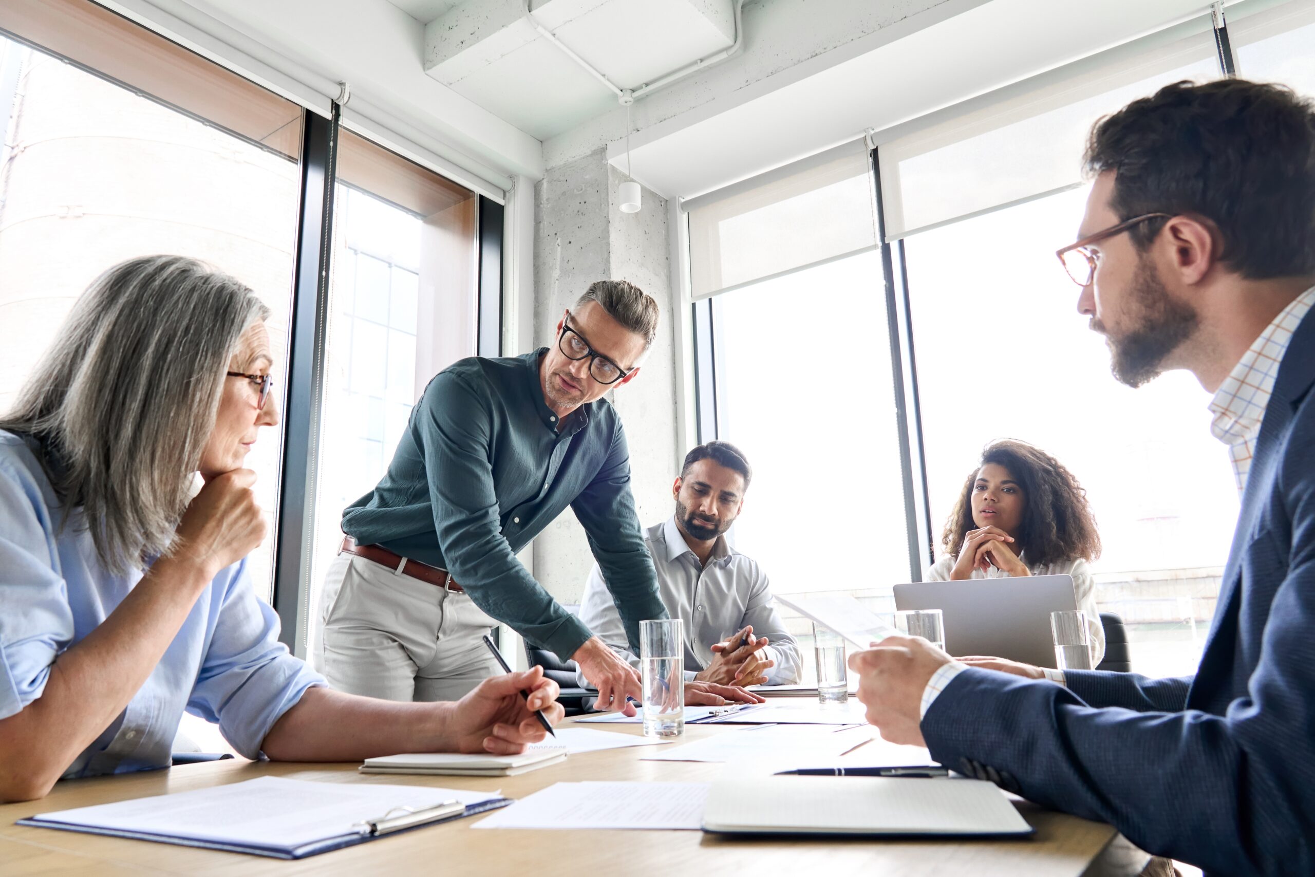 People sitting at a table in a meeting