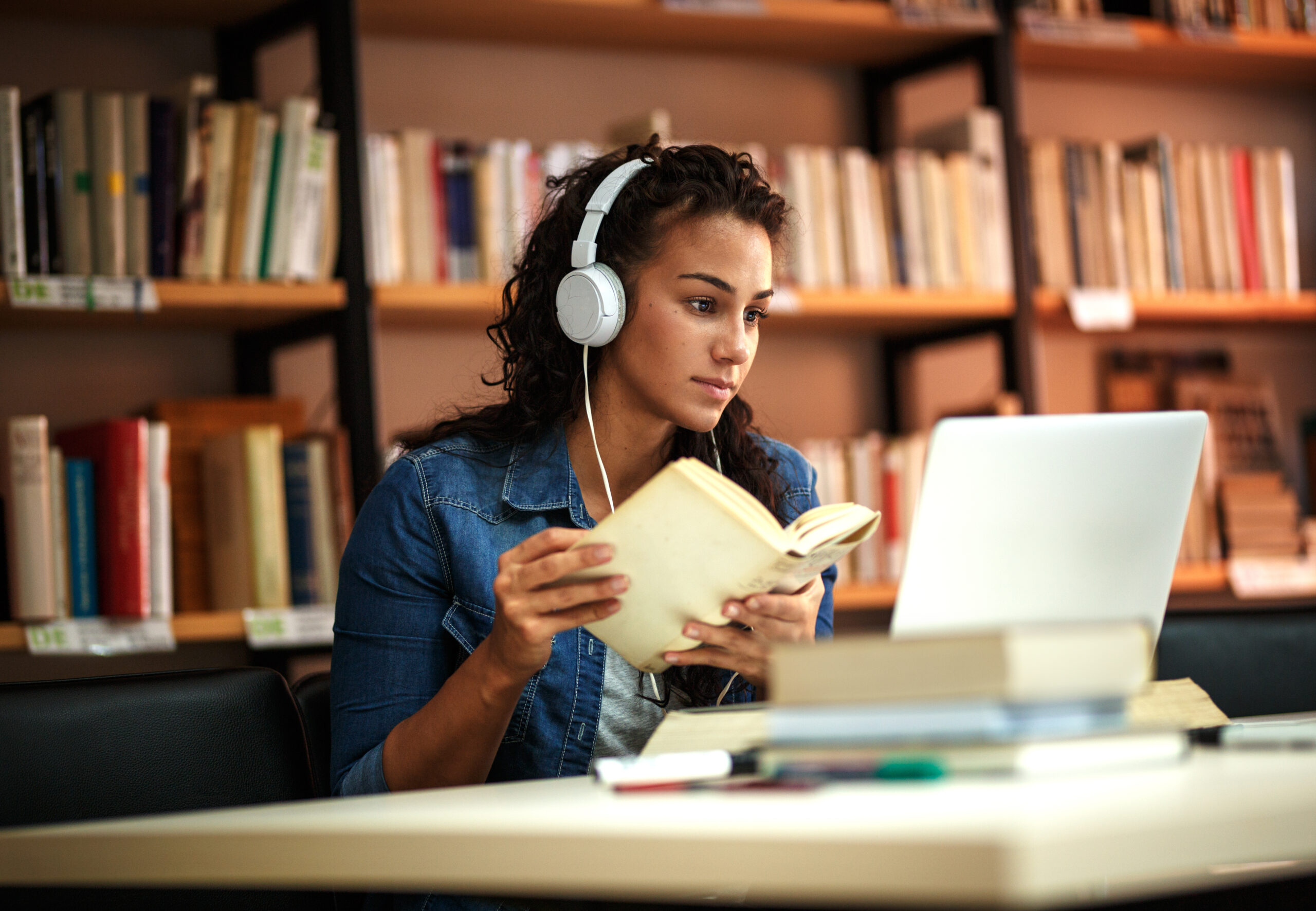 Women reading and looking at computer