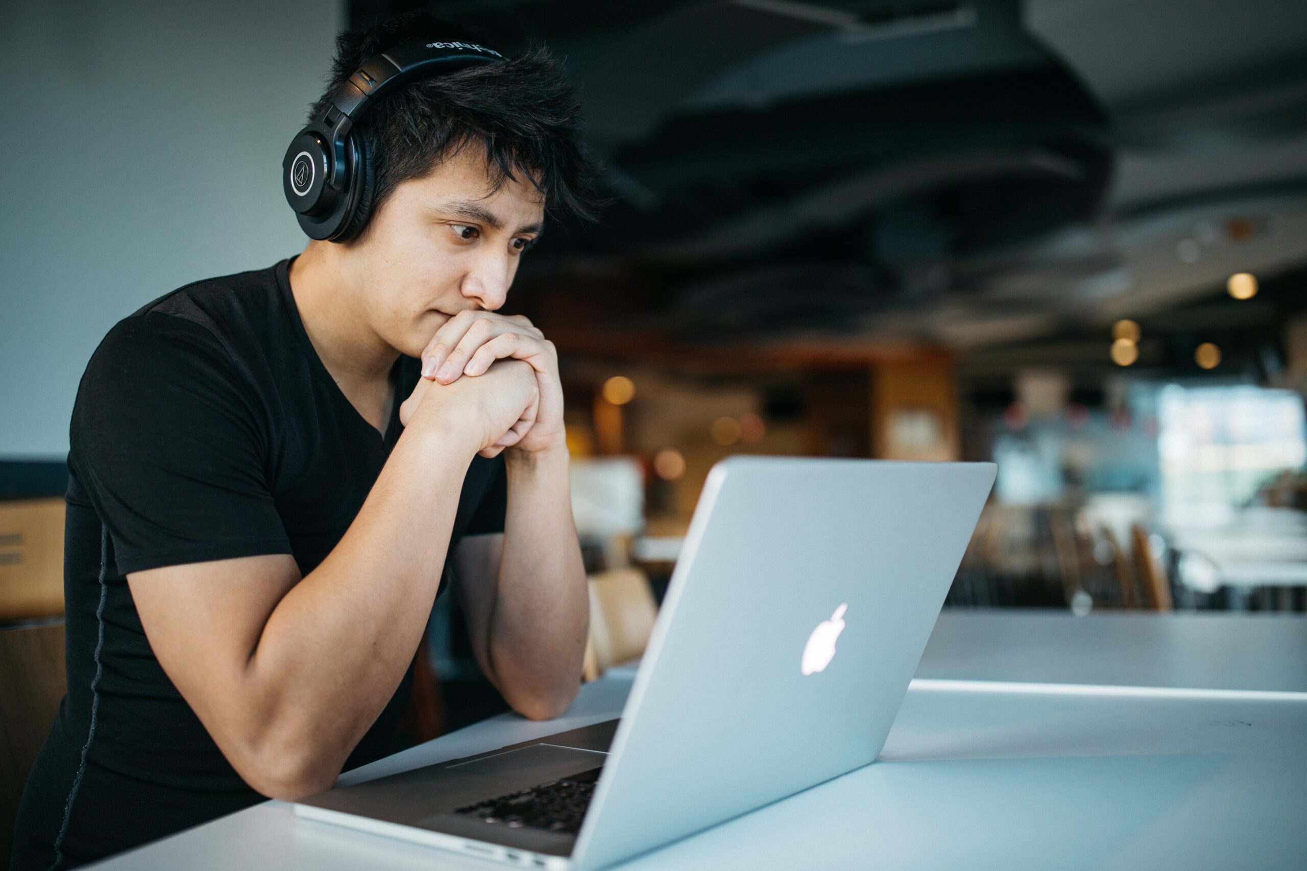 Man concentrating while looking at laptop